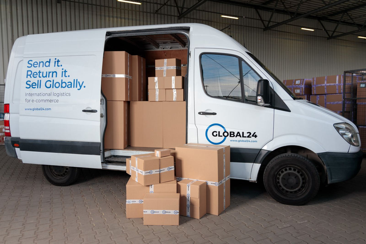 Cardboard boxes loaded in the back of a delivery van in a warehouse, representing goods shipped temporarily abroad for exhibitions