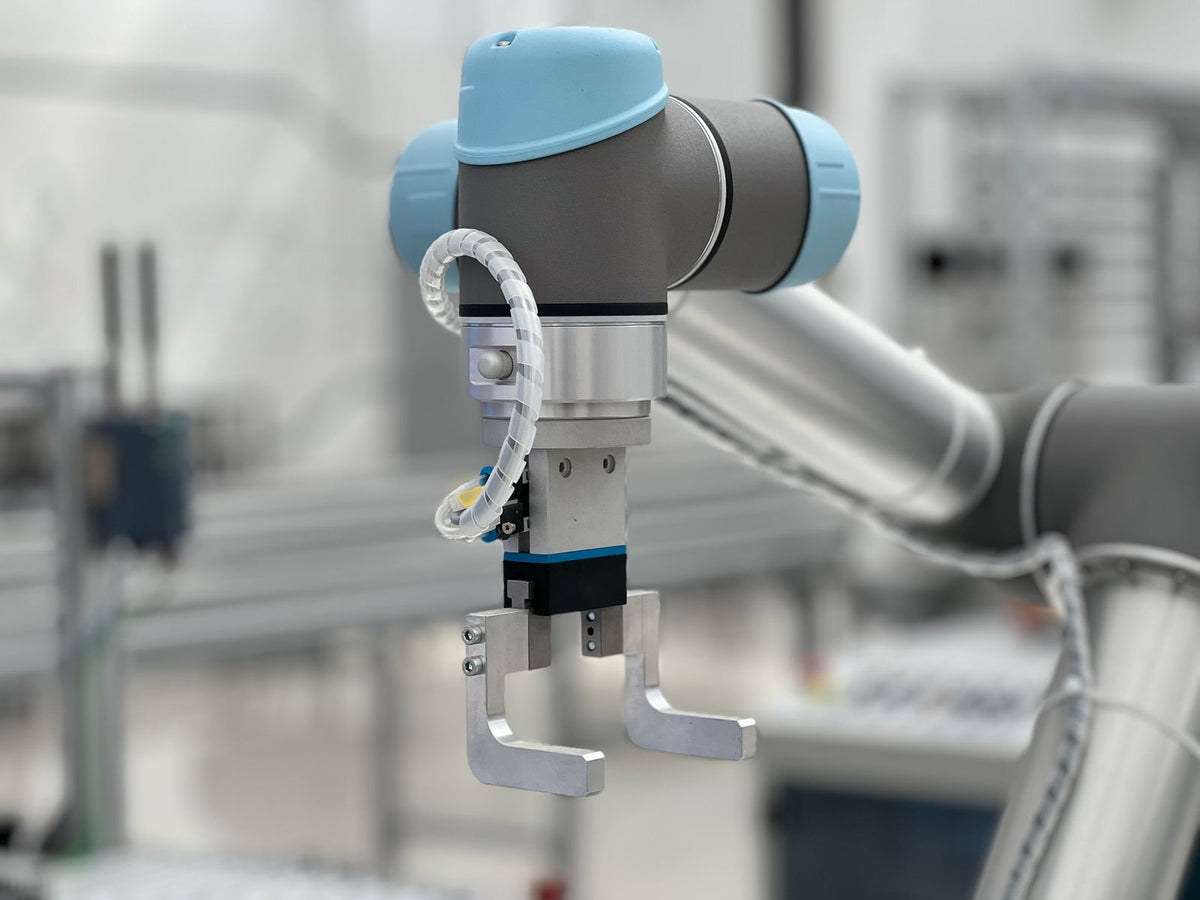 Close-up of an industrial robotic arm in a modern production environment