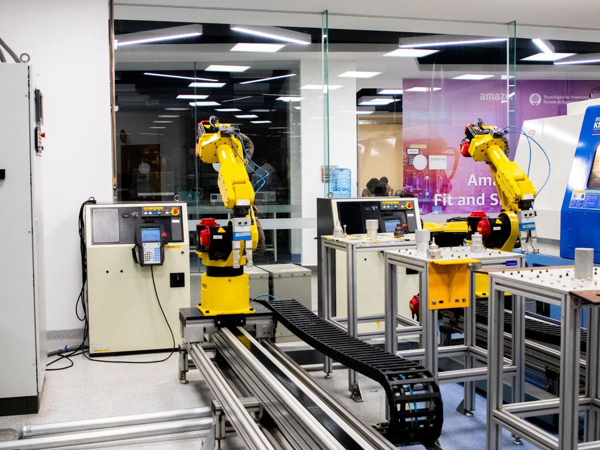 Robotic arms working on an automated factory production line